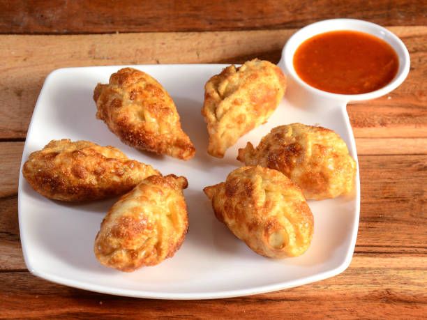 Fried Veg. Paneer Momos available at Aaron Spectra through DeskDrop