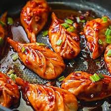 Schezwan Momos available at Novem Square through DeskDrop