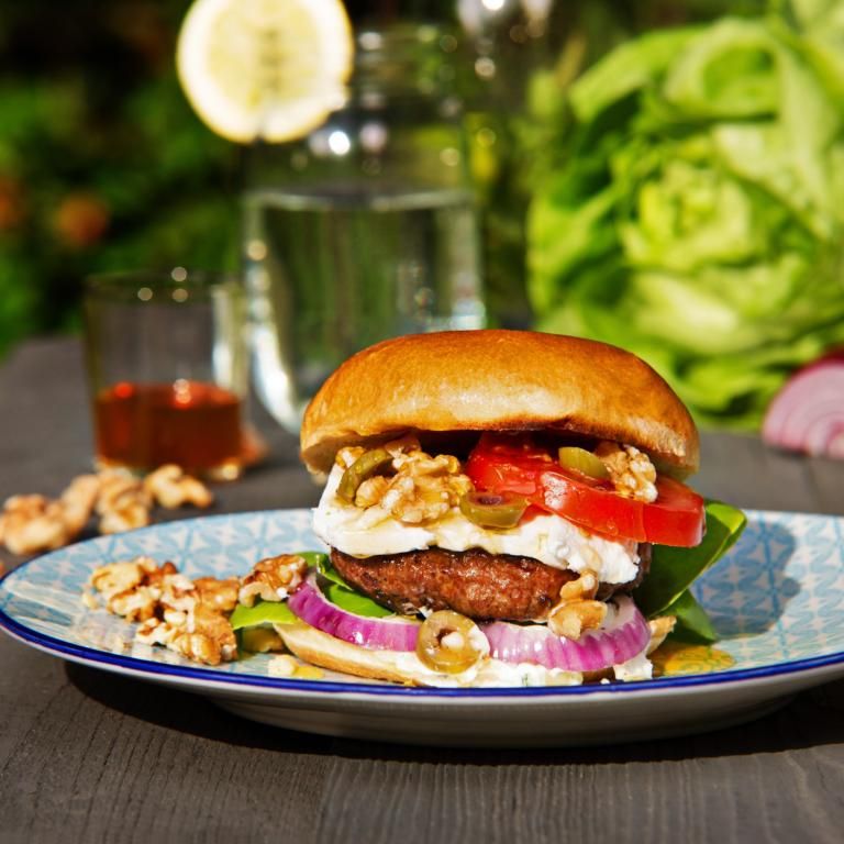 Schezwan Sensation Burger available at Ganesh glory through DeskDrop