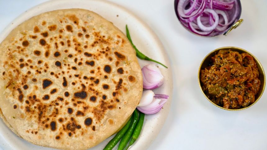 Aloo Pyaz Paratha available at RK World Tower through DeskDrop