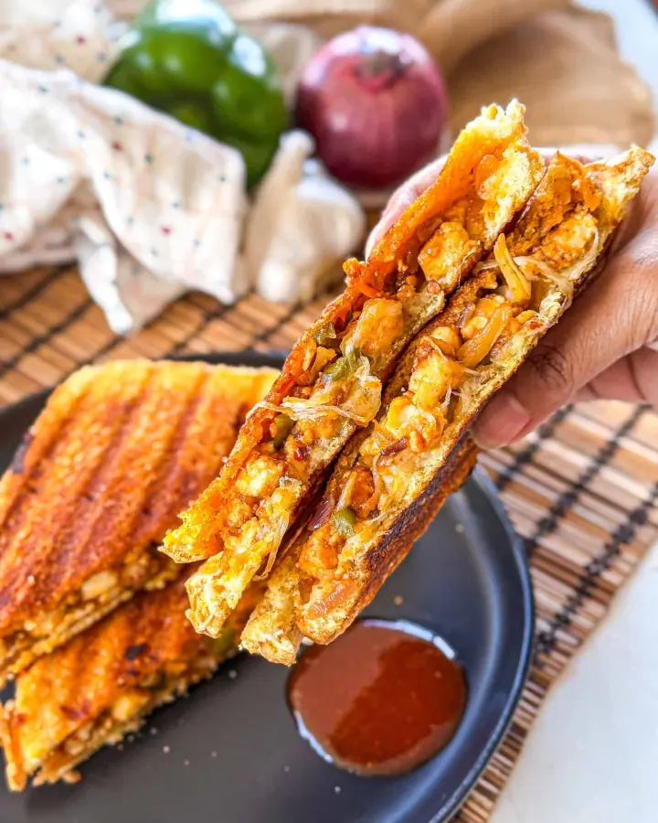 Schezwan Spice Sandwich available at Aakruti BizHub through DeskDrop